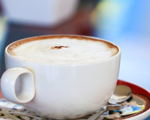 Cappuccino coffee in a white cup