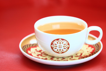 cup of tea on red background