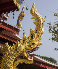 Fototapeta na wymiar gold naga statue