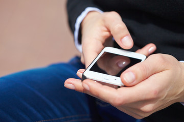 woman's hands with mobile phone