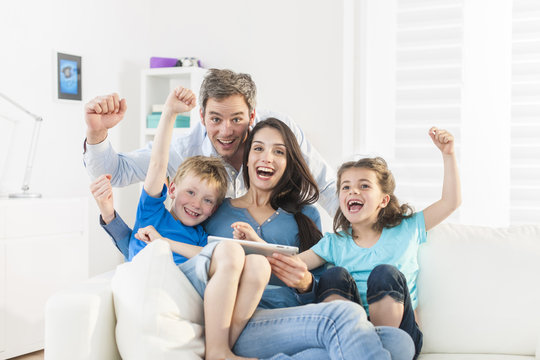 Family Playing Together On A Digital Tablet