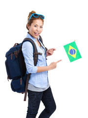Female traveler holding Brazil flag