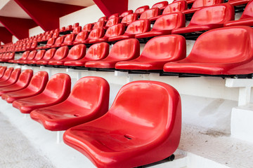red seat in stadium for audience