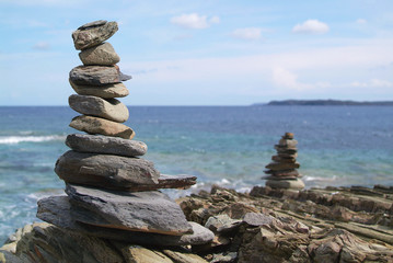 Stack of stones on beach, sea and sky