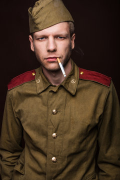 Russian soldier smoking cigarette