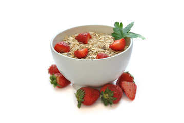 bowl of cereal with milk and strawberries