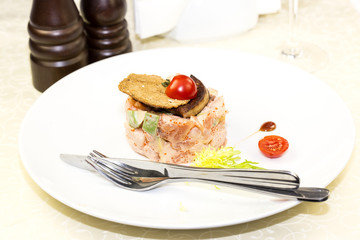 salad, fish and eggs decorated with greens and tomatoes