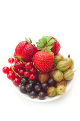 Fototapeta na wymiar Bowl with different fresh juicy berries