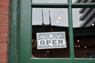 Open sign hang in the door