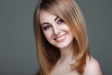 Fototapeta premium Beautiful girl, isolated on a light-grey, emotions, cosmetics