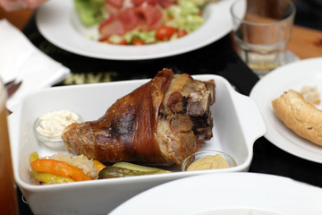 Roasted pork knee on a plate