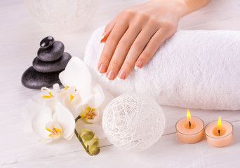 french manicure and wnite orchid flower