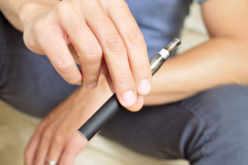 Obraz na płótnie Canvas vaping with an electronic cigarette