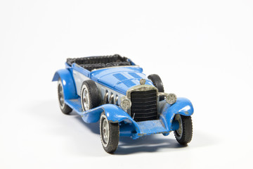 Fototapeta na wymiar Blue Toy Vintage Model Car on White