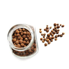 Allspice in a glass bottle