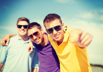 group of friends having fun on the beach