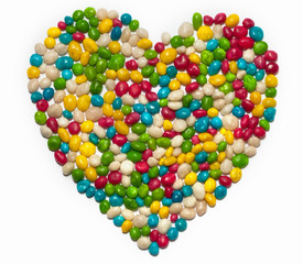 Colorful candies in shape of heart isolated on white background