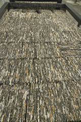 Roof Slates stacked in a railway wagon, edge on.