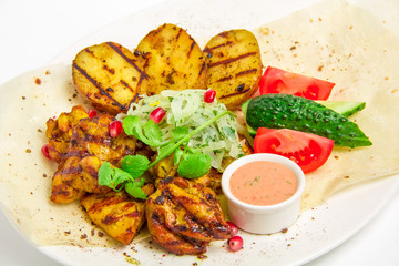 Grilled meat and potatoes