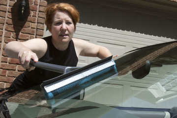 Woman Washing Car Windshield
