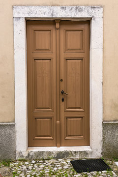 Wooden door with stone frame
