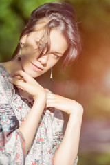 Naklejka premium Portrait of Beautiful Romantic Girl Outdoors. Sunlight Effect. M