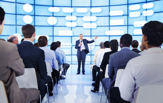 Large Group Of People In Business Presentation.