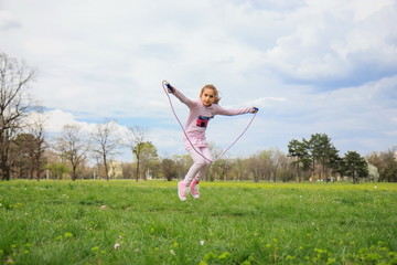 Fototapeta premium Girl with skipping rope