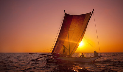Sailing on a Catamaran at Sunset