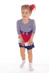 charming little girl posing in studio.