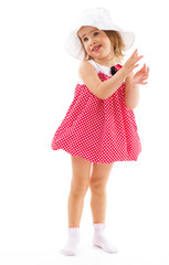 Fashionable little girl in a pink dress.