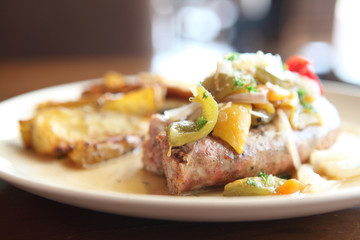 Sausage with potato on wood background