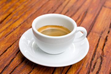 Shot of espresso on table.