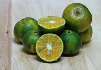 orange fruit on wood table