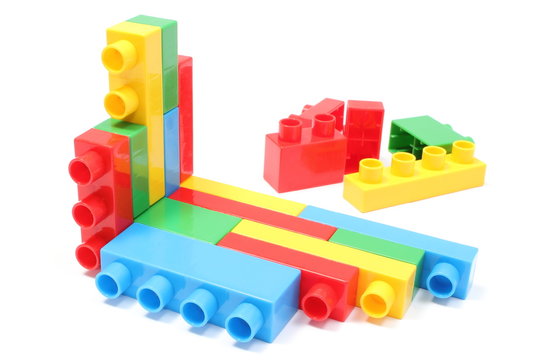 Colorful building blocks for children on white background