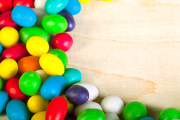 frame  a background from colorful sweets of sugar candies