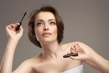 Fototapeta premium beautiful girl with white skin makes makeup