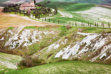 Tuscan landscape with house in the hills