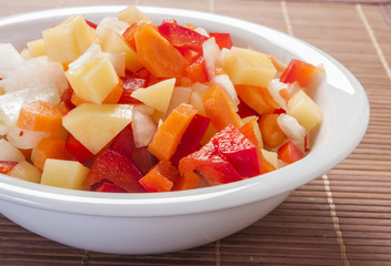 raw vegetable cut in wooden background