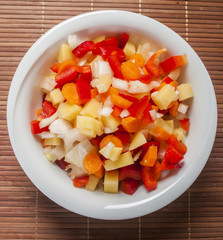 Raw vegetable cut in wooden background close up