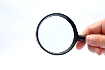 Hand with a magnifying glass