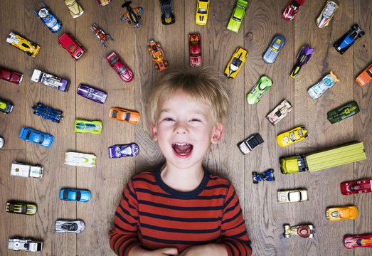 Boy with his toy car collection
