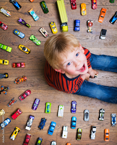 Boy with his toy car collection