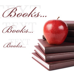 Book with apple isolated on white