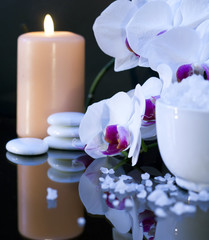 sea salt with candle and orchid