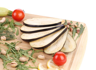 Vegetables on wooden board.