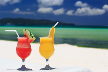 fruit cocktails on tropical beach