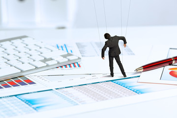 businessman puppet doll is on the desk