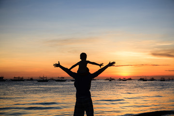 happy family on sunset beach