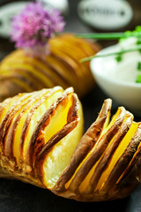 Finely sliced foil baked potato in the skin